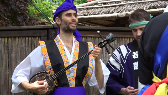 Me performing utasanshin for Eisa dancers outdoors