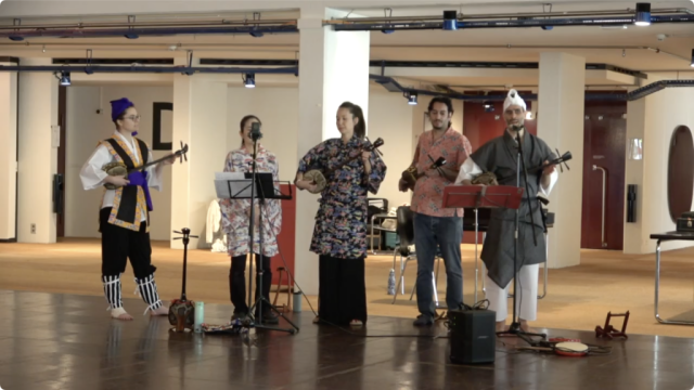 A group of sanshin players performing